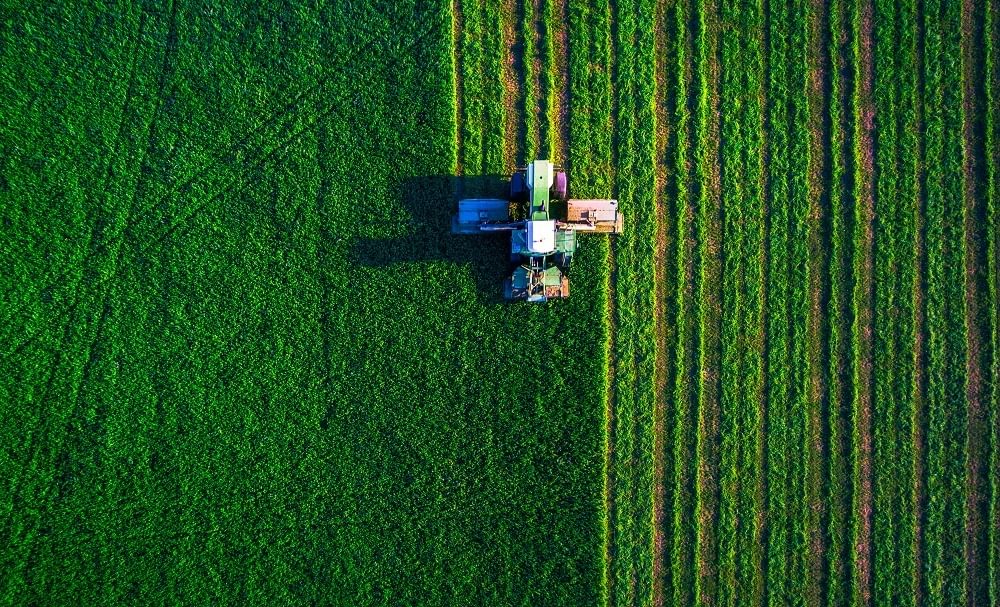 Agriculture tractor field plowing 2
